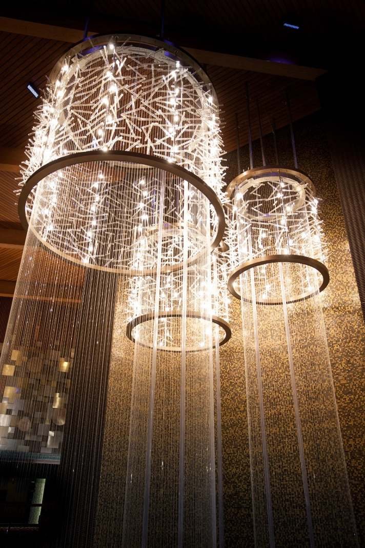 Custom cascading crystal chandeliers with bronze rings